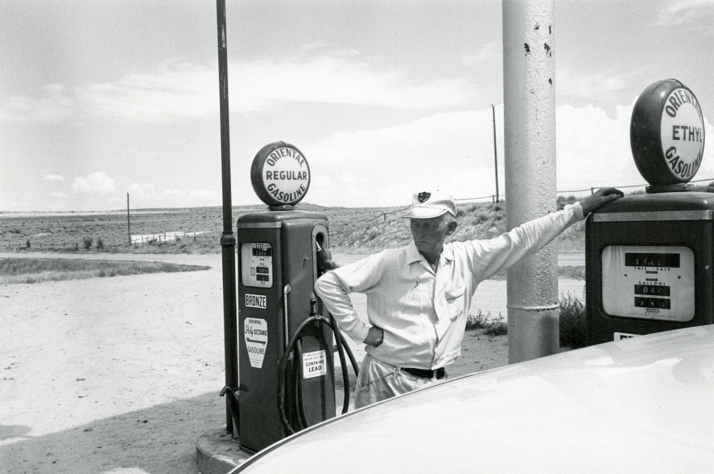 Gas Station Attendant, Nebraska, 1970 — a gelatin silver photograph by Walt Odets